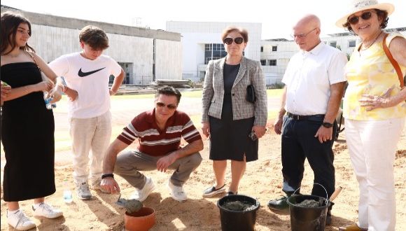 David Baazov and family lay the cornerstone for the Baazov Accessible Playground. 