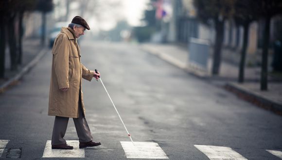 Blind man crossing street 