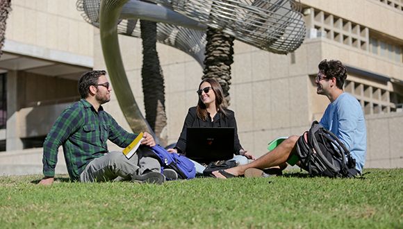 Students relaxing on the Tel Aviv University campus lawn