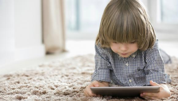 Child uses digital tablet 